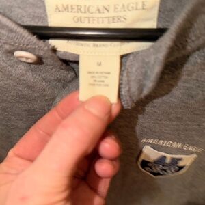 Men’s medium size American Eagle Gray and Navy Polo long sleeve shirt